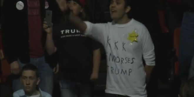 Protester wears shirt 'KKK endorses Trump'