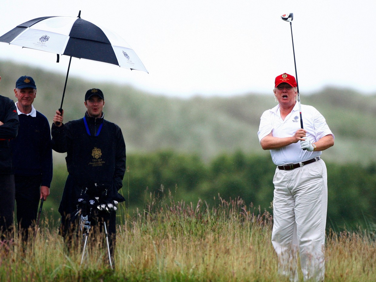 Trump golfing in the rain